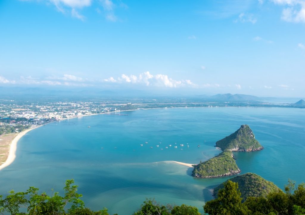 Things to do in Prachuap Khiri Khan. Aerial view of Ao Manao beach with small islands jutting out the turquoise waters