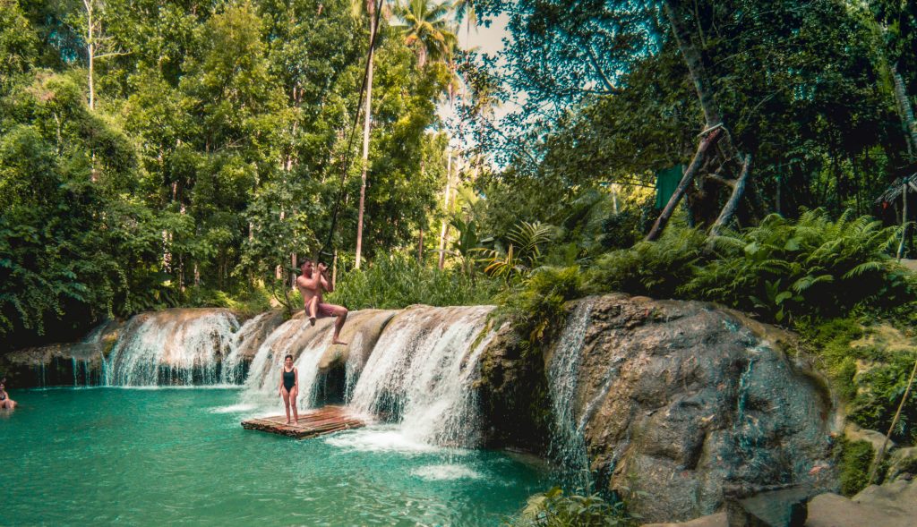 Tarzan swings are all over the Philippines. Here I'm swimming over a turquiose pool and waterfall in Siquijor