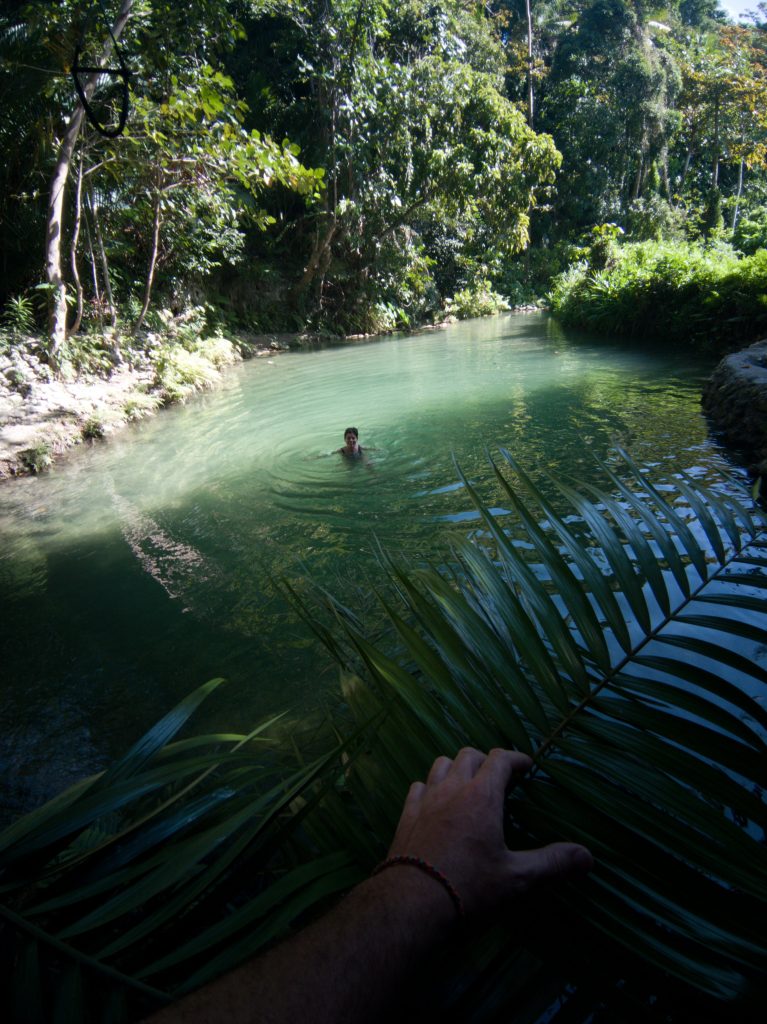 Jacqueline taking a refreshing dip at the first pool in Locong Falls