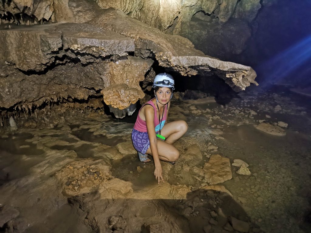Inside Cantabon Cave is pitch black however I managed to shoot a few photos like this where Jacqueline poses near rock formations