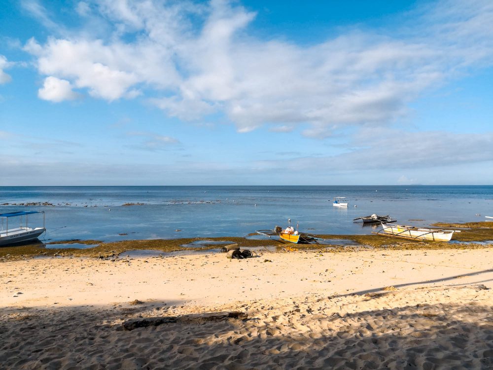 Outrigger boats docked on Tubod beach