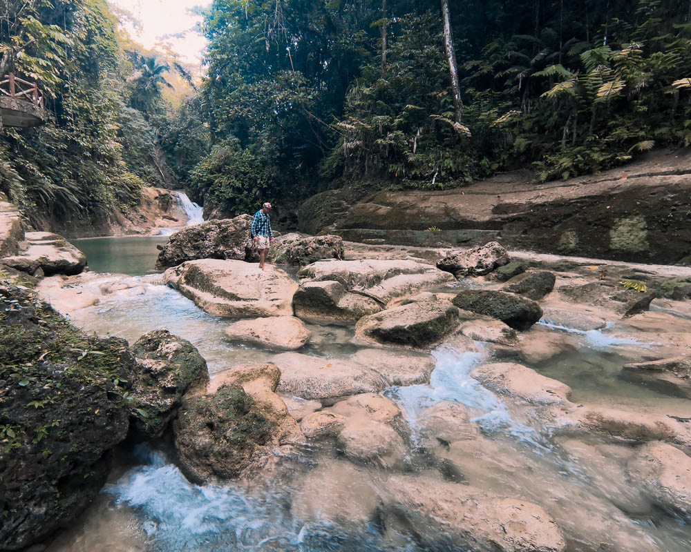 The stream passing through the remains of the bridge