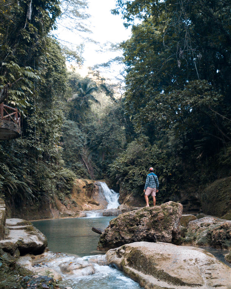 Crossing over what was once a bridge but is no more after an earthquake hit the area
