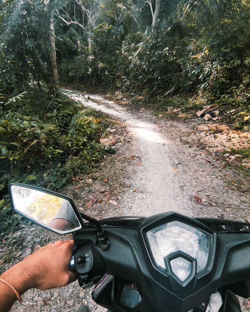 The asphalt road eventually turned into a dirt path only accessible by scooter