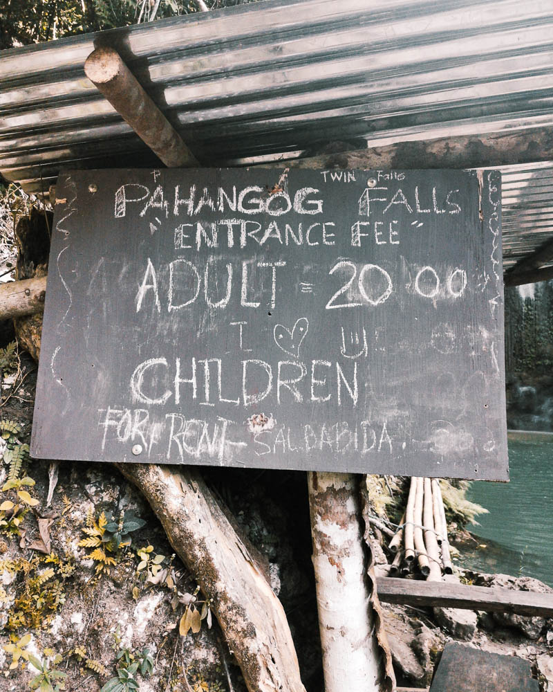 A black board with entrance fee price