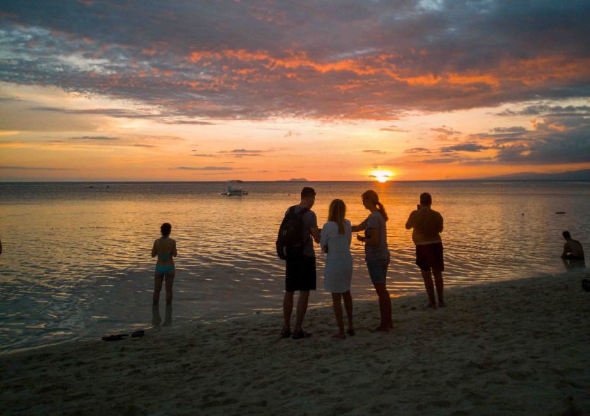 Pink sunset on a tropical beach in Siquijor