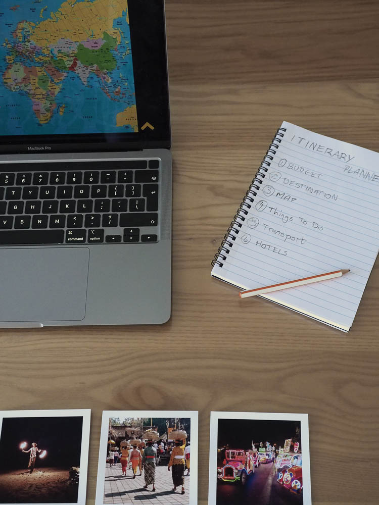 In this image I placed my notebook, pencil, and few polaroids of my last trip which help me decide where my next destination will be