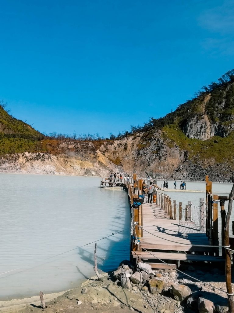 A wooden bridge crossing through the sulfuric lake