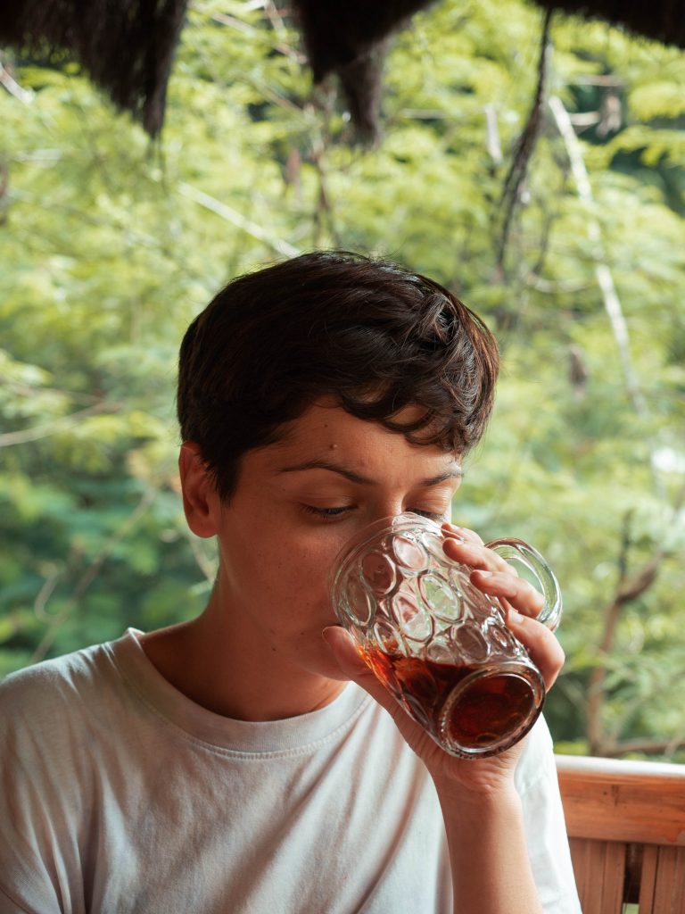 Jacqueline drinking the traditional of Indonesia