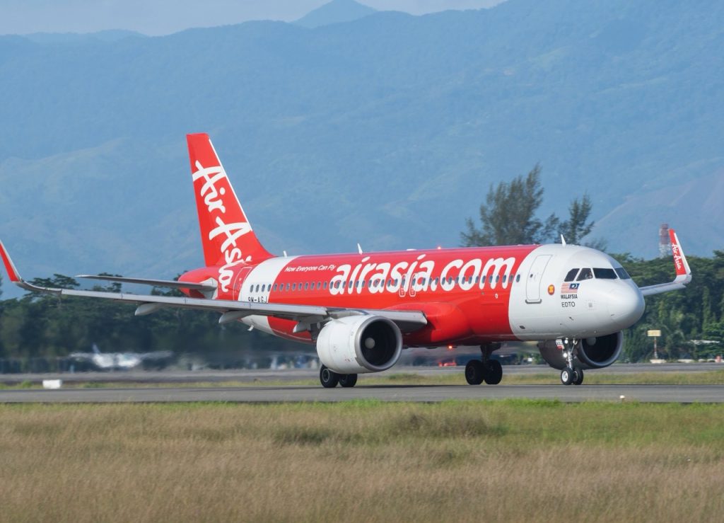 An air asia plane taxiing at airport