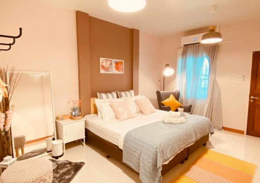 Where to stay in Kanchanaburi. A cute room with colored furnitures and soft furnishing.