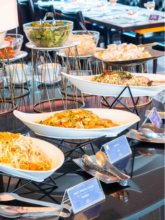A buffet table with various food