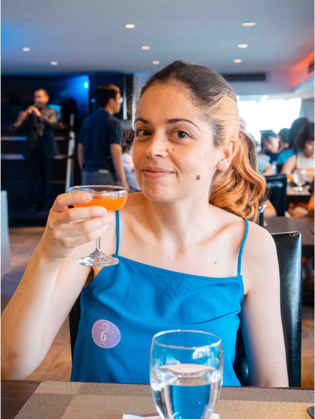 Jacqueline enjoying a cocktail drink