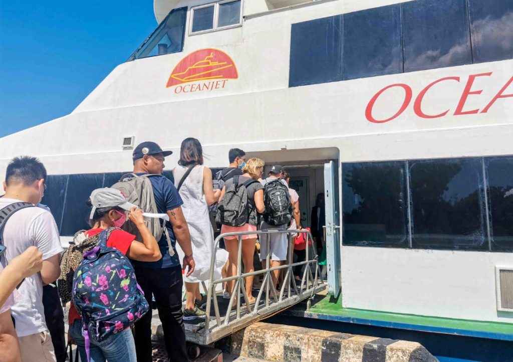 Moalboal to Siquijor ferry. Passengers boarding a ferry from Dumaguete to Siquijor