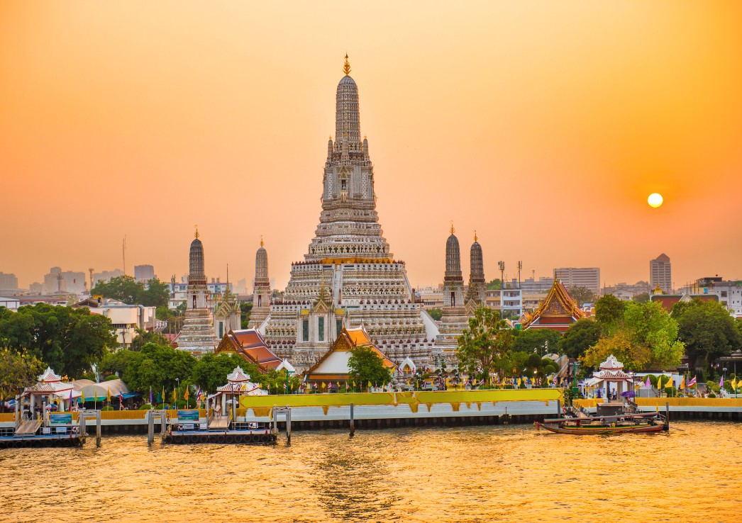 Wat Arun. View of temple in Bangkok next to a river