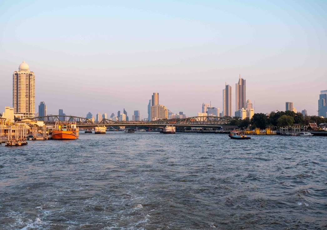 Bangkok riverfront with a skyline of towering skyscrapers