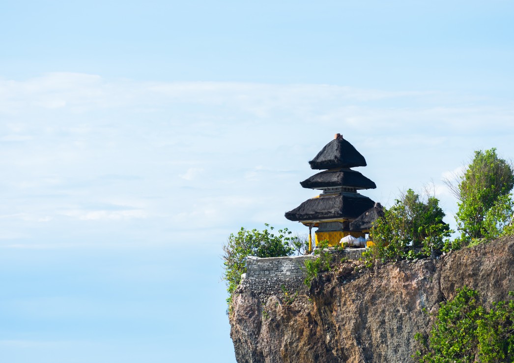 A temple perched on a cliff in Uluwatu Bali