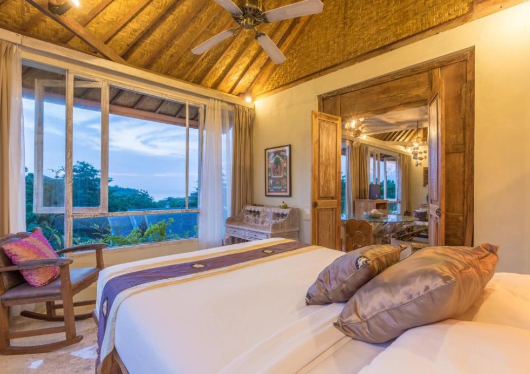 A luxury room with raw furnishing and boho touches