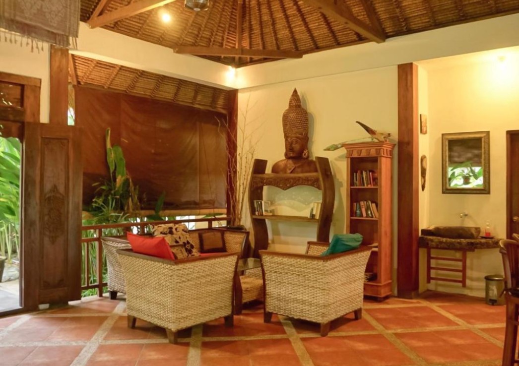 A traditional Indonesian house from inside with teak wood furnishings