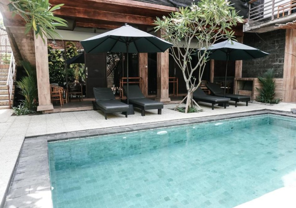 Sun loungers next to a pool