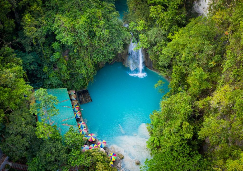 Kawasan waterfall. A waterfall from above with turquoise water and surrounded in jungle. Siquijor to Cebu